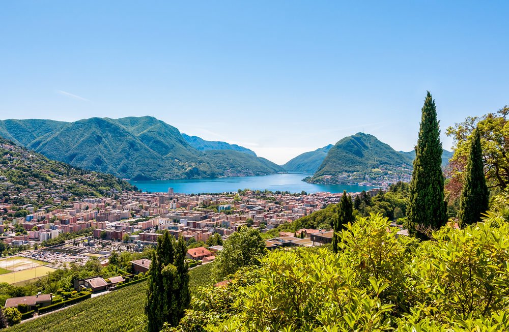 Landscape of Lugano lake, mountains and the city located below, Ticino, Switzerland