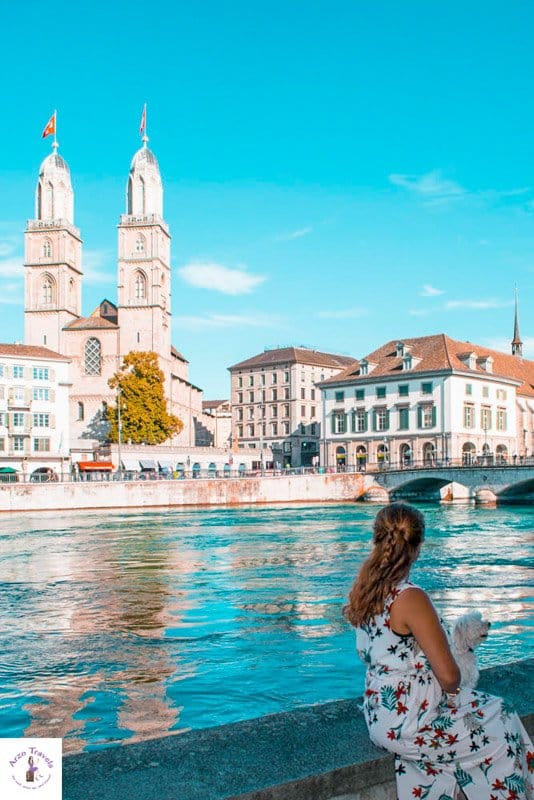 Solo female travel girl in Zurich in 2 days with Grossmünster in background