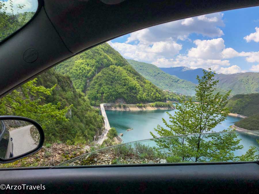 Window views when road tripping Montenegro Driving around Piva Lake in Montenegro_